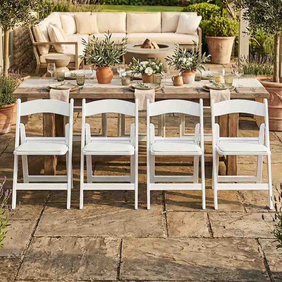 4 Pack White Folding Chair with Resin Frame and Padded Seat for Patio Events